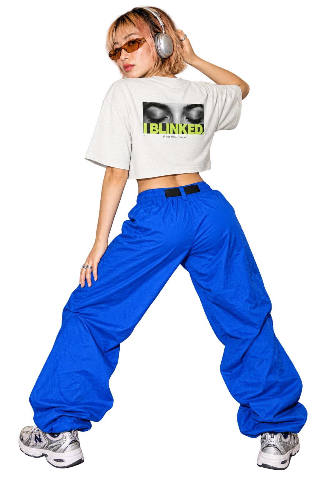 I BLINKED cropped tee worn by a model, back view, studio