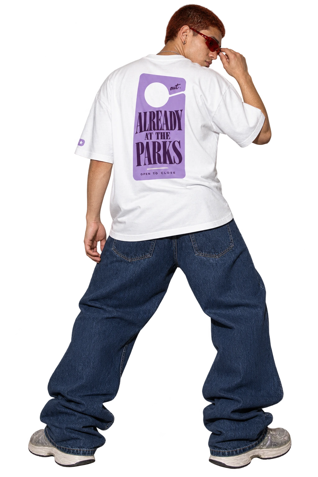 Out Early. Back Late. tee worn by a model, back view, studio