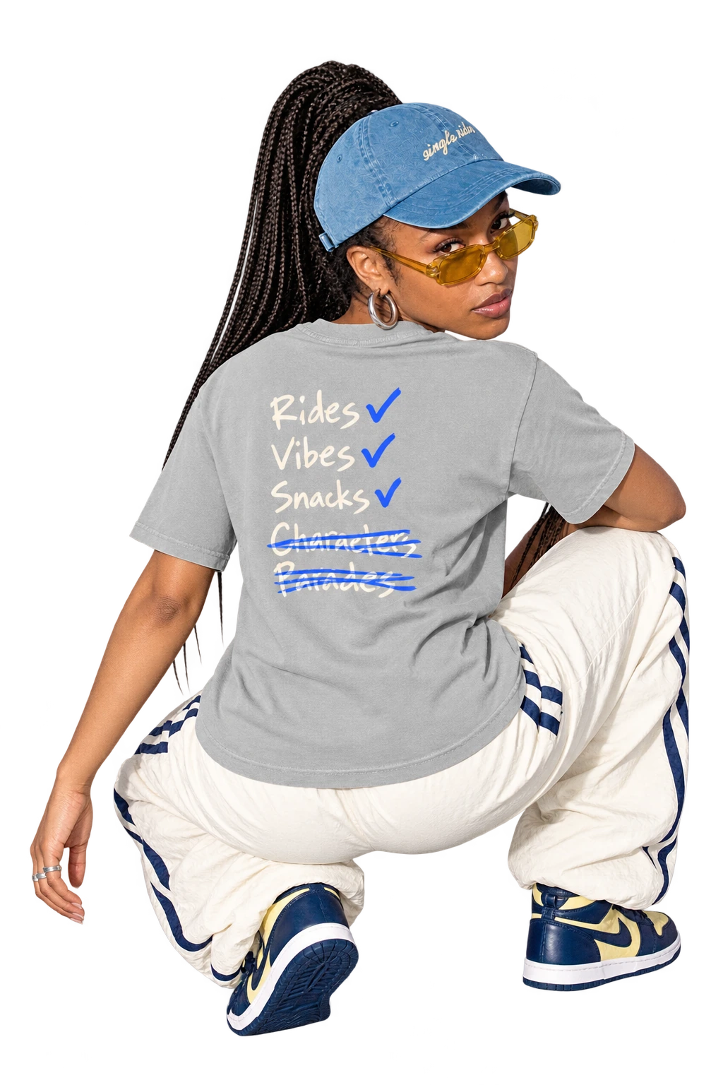 Rides, Vibes & Snacks tee worn by a model, back view, studio