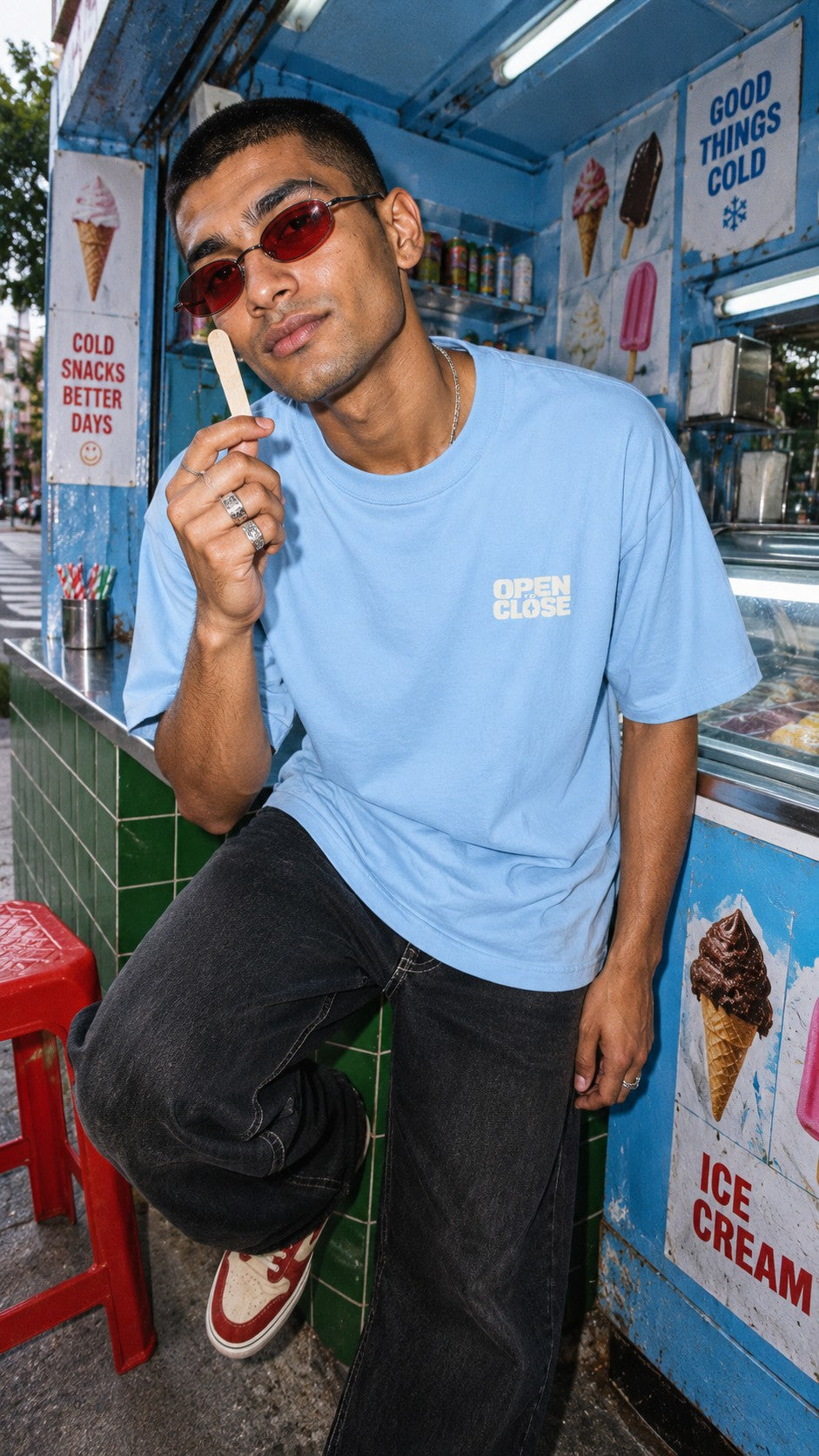 RIP Ice Cream tee worn by a model, front view, at an ice cream kiosk