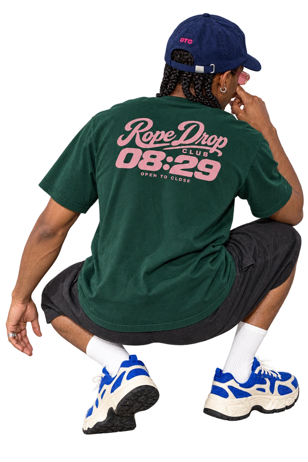 Rope Drop Club tee worn by a model, back view, studio
