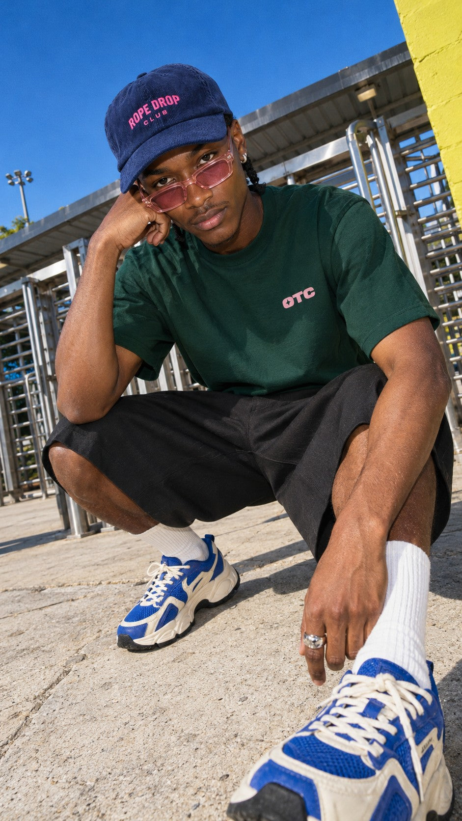 Rope Drop Club tee worn by a model, front view, by the entry gates